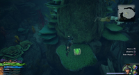 The High Seas / Sandbar Isle: On the island, on the side of the pillar in the center of the pool of water.